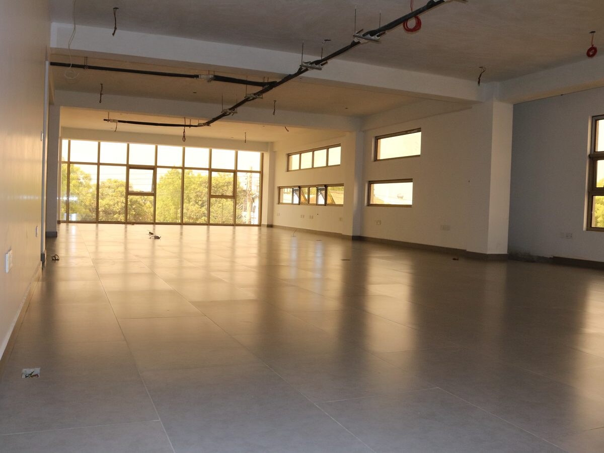 Open-plan office floor, floor-to-ceiling glazing